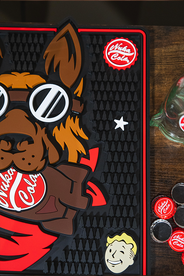 Product with cartoon dog design and Coca-Cola branding on a dark surface.
