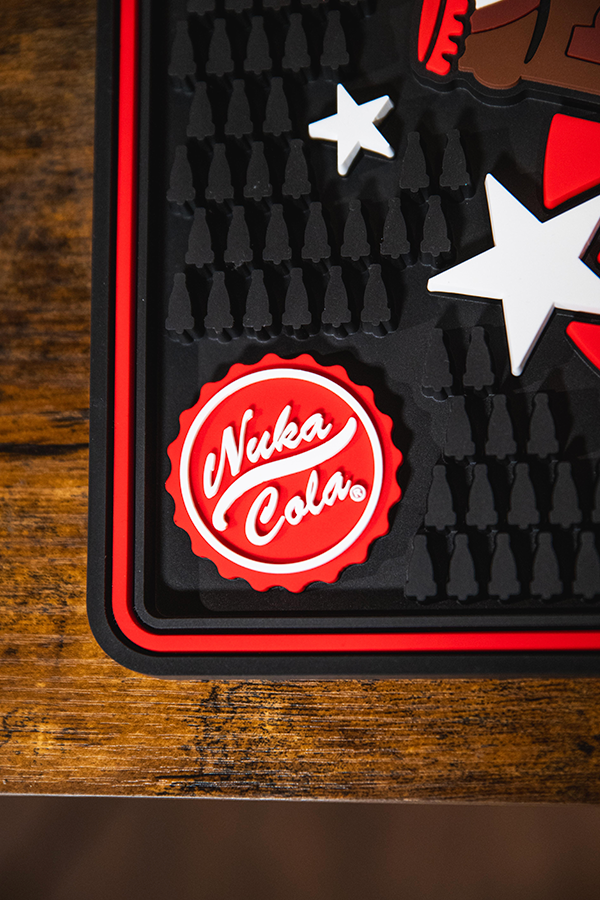 Nuka Cola logo on a textured surface with star designs