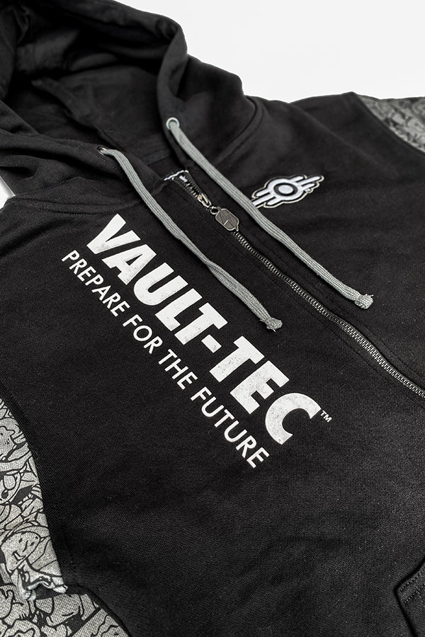 Image: Vault-Tec Hoodie detail view of zipper, front embroidery, and front logo