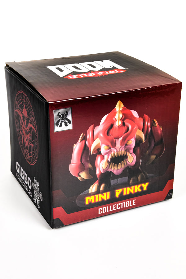 Quarter view of the box, revealing a side that shows a pentagram with the skull of a horned animal in red, and the Gibbo Collectibles logo.