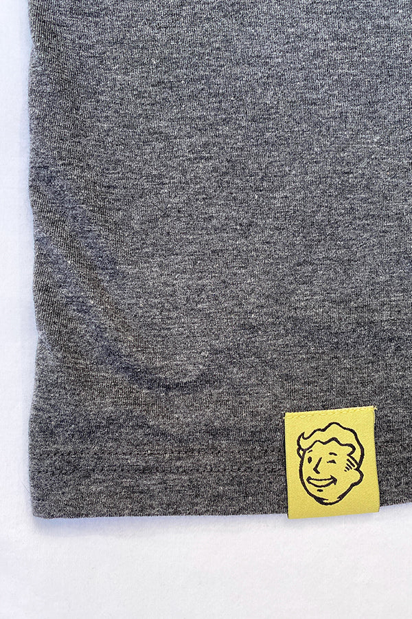 Image: Fallout Vault Lounger Pajama Set closeup of Vault Boy tag