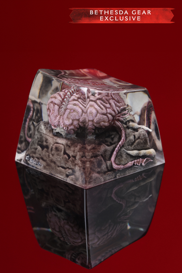 Glossy, hexagonal object with brain design on a red background, Bethesda Gear Exclusive label.