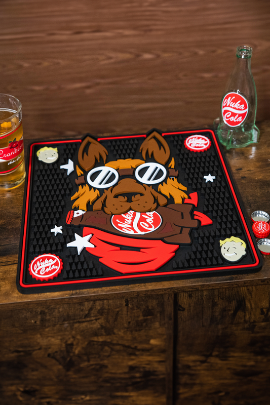 Valkyrie Co. branded mat with cartoon bear design on a wooden surface with a glass of beer and bottle.