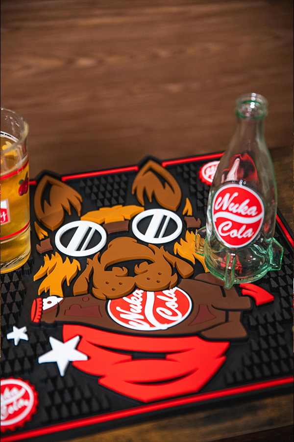 Nuka Cola bottle and bear design on a mat with a wooden background