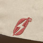 Image: Fallout RobCo Atomic Shop Hat closeup of lightning logo