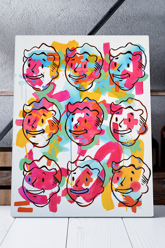 The Fallout Vault Boy Pop Art Canvas Print, an 18” x 24” artwork printed on canvas then stretched over a wooden frame. It features 9 of the same line art Vault Boy heads on a 3x3 grid. In the background are strokes of yellow, blue, green, and pink—painting each Vault Boy face with a different pattern.