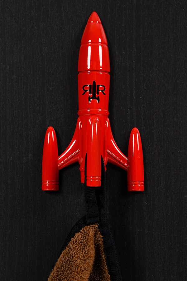 A Fallout Red Rocket Coat Hanger in use, mounted on a wall.