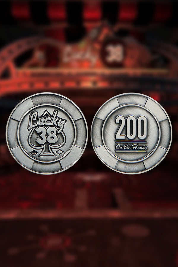 Front and back of the metal poker chip, showing the embossed Lucky 38 spade logo and “200 On the House” respectively.