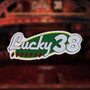 Front of the Lucky 38 metal pin badge.