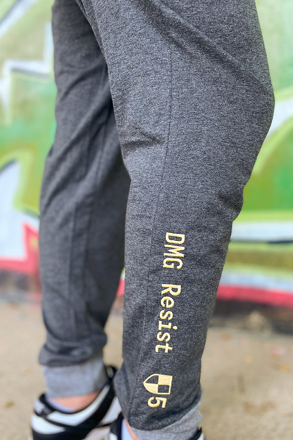 Image: Fallout Vault Lounger Pajama Set closeup of leg embroidery